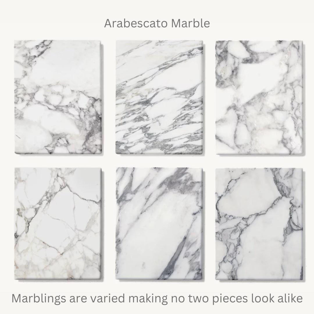 Arabescato marble sample variations showcasing unique veining patterns, ideal for crafting elegant dining tables for modern UAE homes.