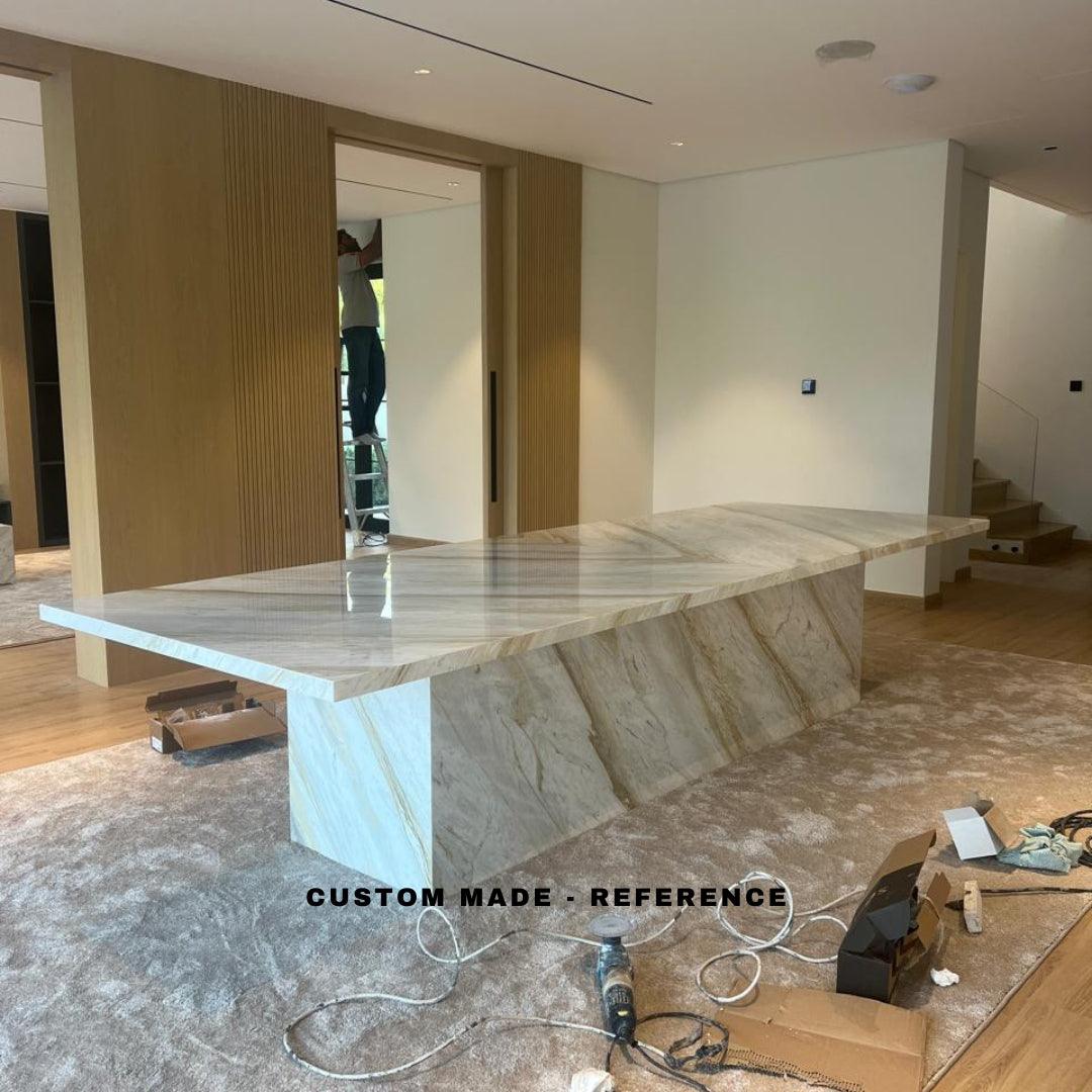 Custom-made Marina Plinth dining table with a luxurious Arabescato marble top and modern rectangular design, ideal for elegant UAE dining spaces.