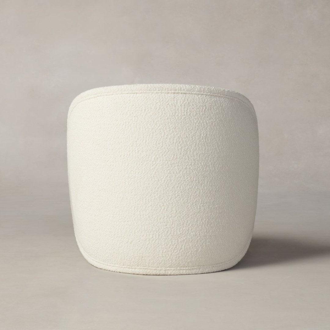Back view of the Dima Boucle Armchair with boucle fabric upholstery, showcasing its modern and minimalist design, perfect for stylish living spaces.