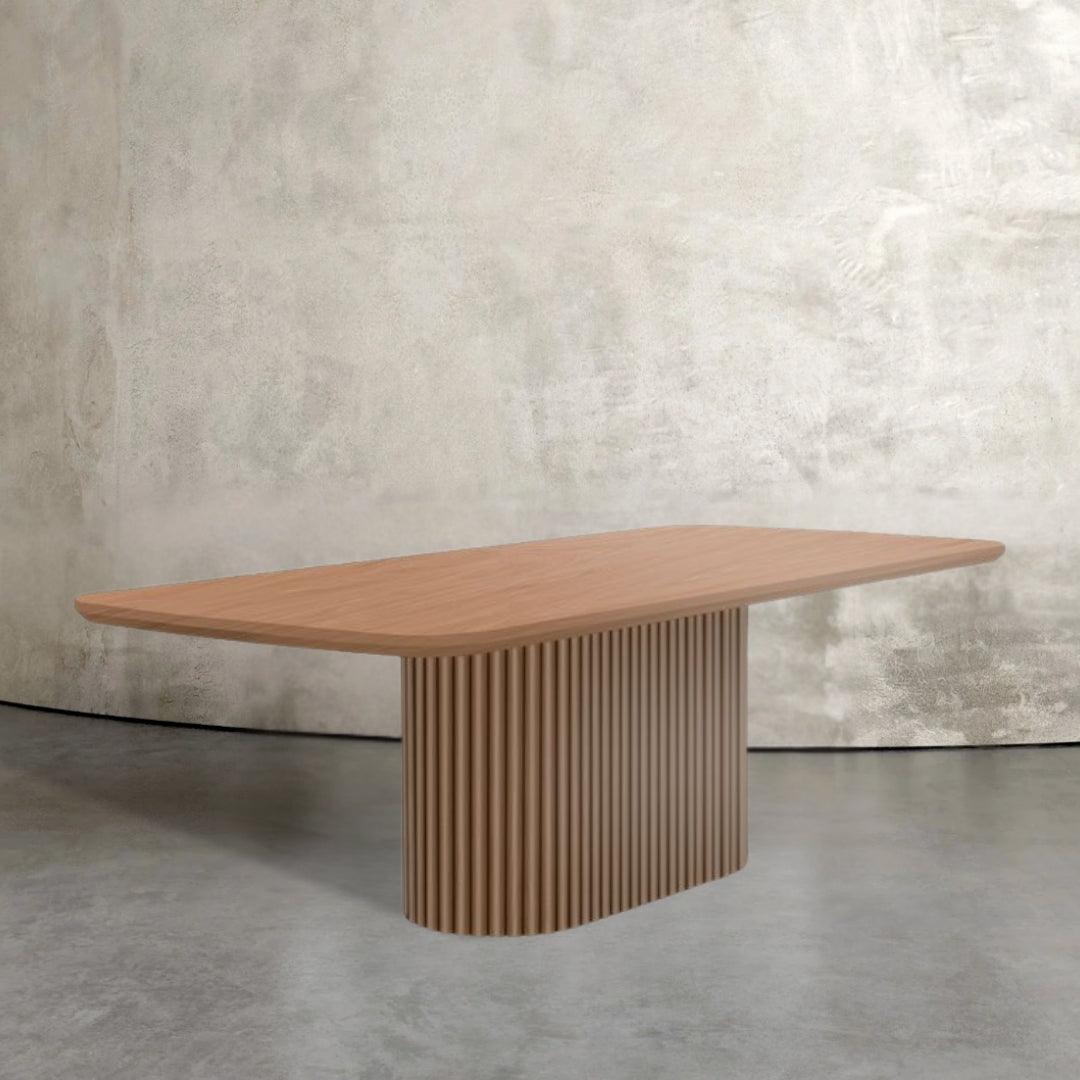 Levant fluted wood dining table with racetrack base and rectangular top, modern dining table design for UAE homes.