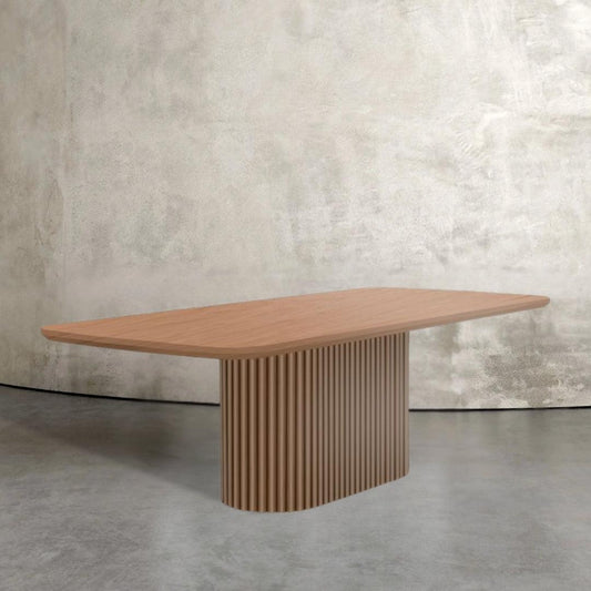 Levant fluted wood dining table with racetrack base and rectangular top, modern dining table design for UAE homes.