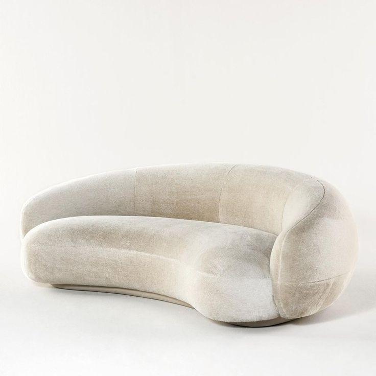 Nara Lounge Sofa with a curved design, upholstered in soft velvet fabric, perfect for modern living rooms and elegant homes in UAE.