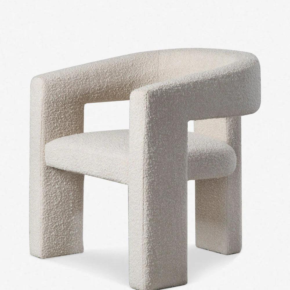 Close-up of the Sia Boucle Chair with boucle fabric and a modern curved design, perfect for dining spaces and contemporary interiors.
