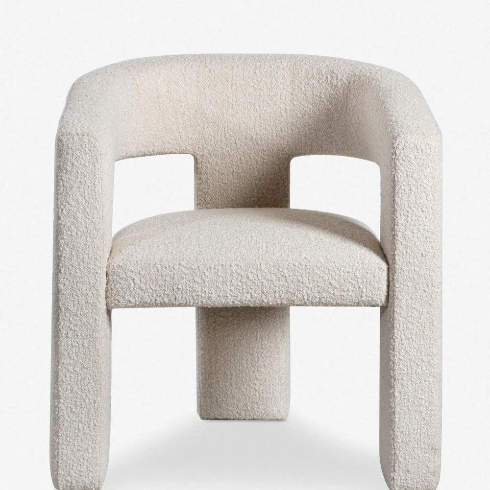 Front view of the Sia Boucle Chair with boucle fabric upholstery and modern design, perfect for stylish dining rooms and contemporary interiors.