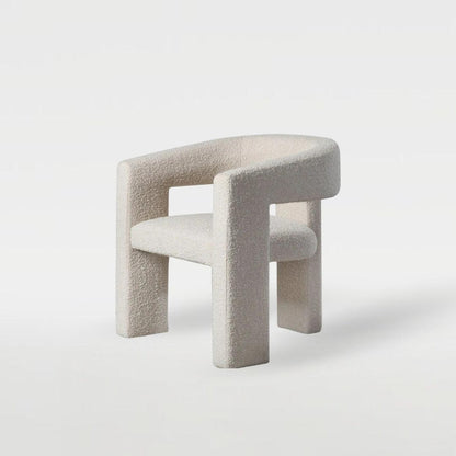 Sia Boucle Chair with boucle fabric upholstery, modern curved design, and minimalist look, perfect for elegant dining spaces and contemporary interiors.