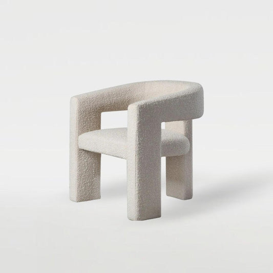 Sia Boucle Chair with boucle fabric upholstery, modern curved design, and minimalist look, perfect for elegant dining spaces and contemporary interiors.