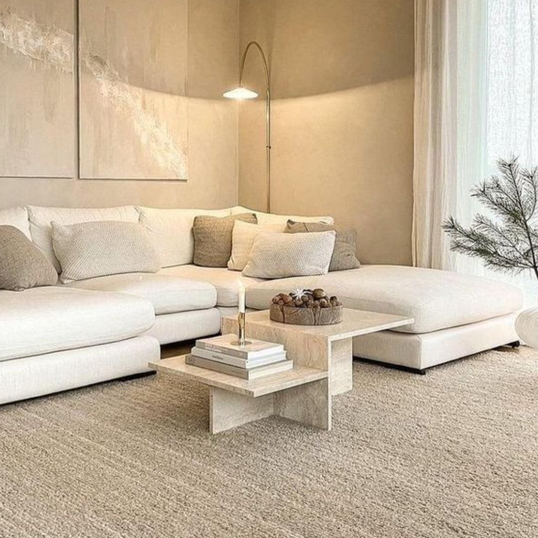 Soho Travertine Coffee Table, made from natural travertine limestone, features a uniquely inspired design with beige tones and a modern minimalist style, making it perfect for luxury living rooms in the UAE.