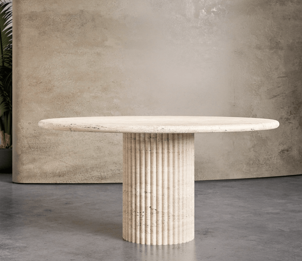 Travertine Marble Dining Table with a fluted pedestal base and round top, showcasing natural beige tones and elegant craftsmanship for UAE dining rooms.