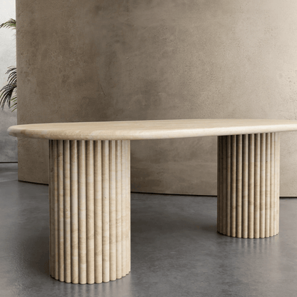 Elegant Travertine Marble Dining Table with reeded pedestal bases and natural stone finish, perfect for luxury dining spaces in UAE homes.