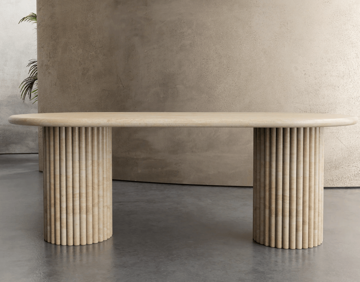 Elegant Travertine Marble Dining Table featuring dual reeded pedestal bases and a smooth oval top, perfect for modern and minimalist UAE homes.