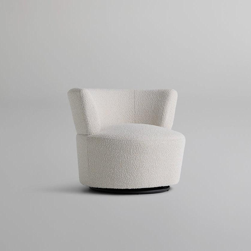 Front view of the Troi Boucle Armchair with a round, cloud-like seat upholstered in boucle fabric, perfect for modern minimalist and elegant interiors.