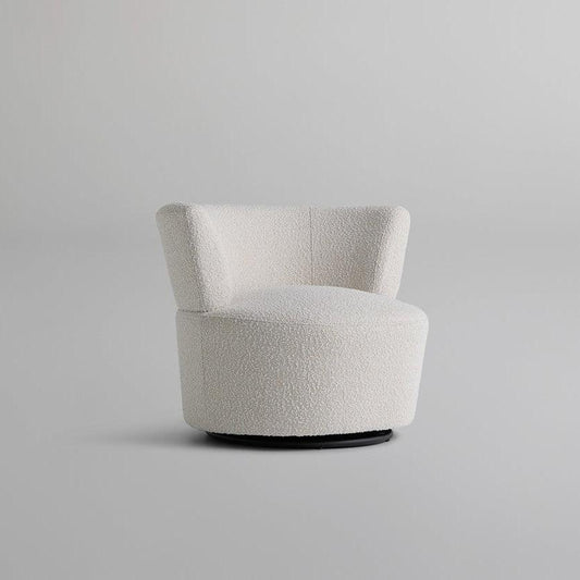 Front view of the Troi Boucle Armchair with a round, cloud-like seat upholstered in boucle fabric, perfect for modern minimalist and elegant interiors.