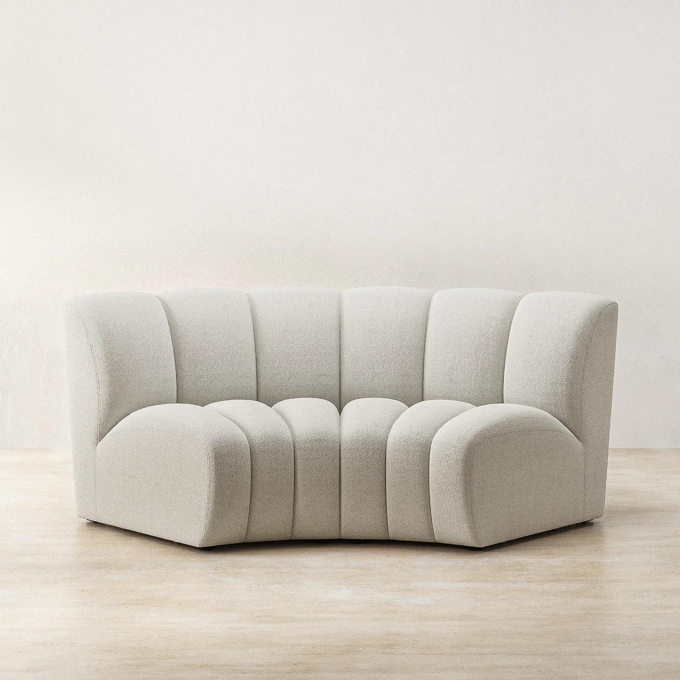Ceci Cloud Sofa in off-white boucle fabric, featuring a compact curved tufted design. Perfect for modern and stylish living spaces in UAE.