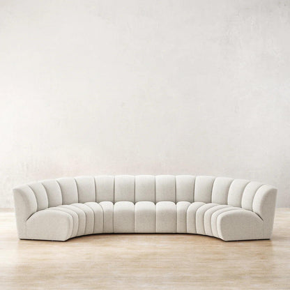 Ceci Cloud Sofa in off-white boucle fabric, featuring a curved tufted design. A luxurious modern centerpiece for spacious living rooms in UAE.