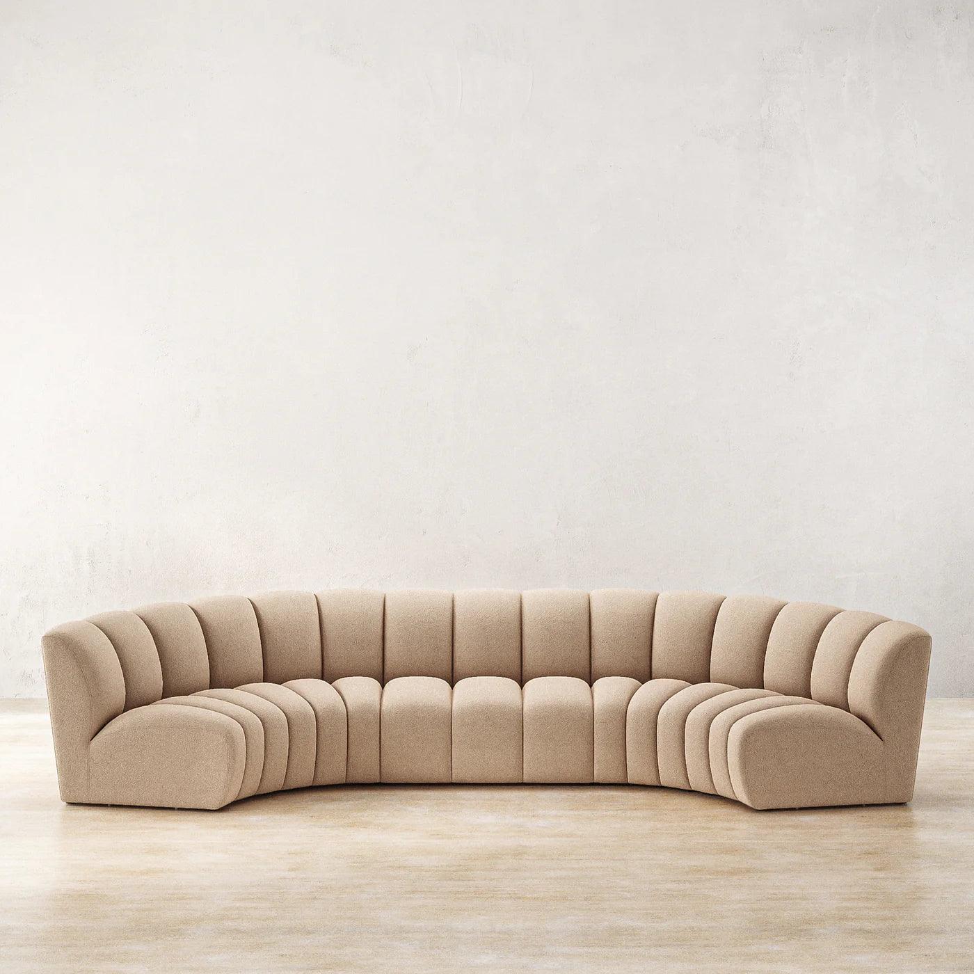 Ceci Cloud Sofa in tan boucle fabric, featuring a spacious curved design. A perfect centerpiece for modern and luxurious living rooms in the UAE.