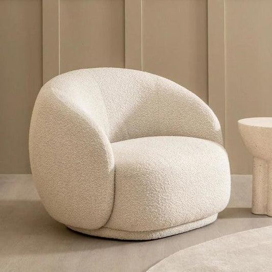Cloud Boucle Armchair with a curved backrest and plush foam cushion, upholstered in white boucle fabric, perfect for modern and elegant living spaces.