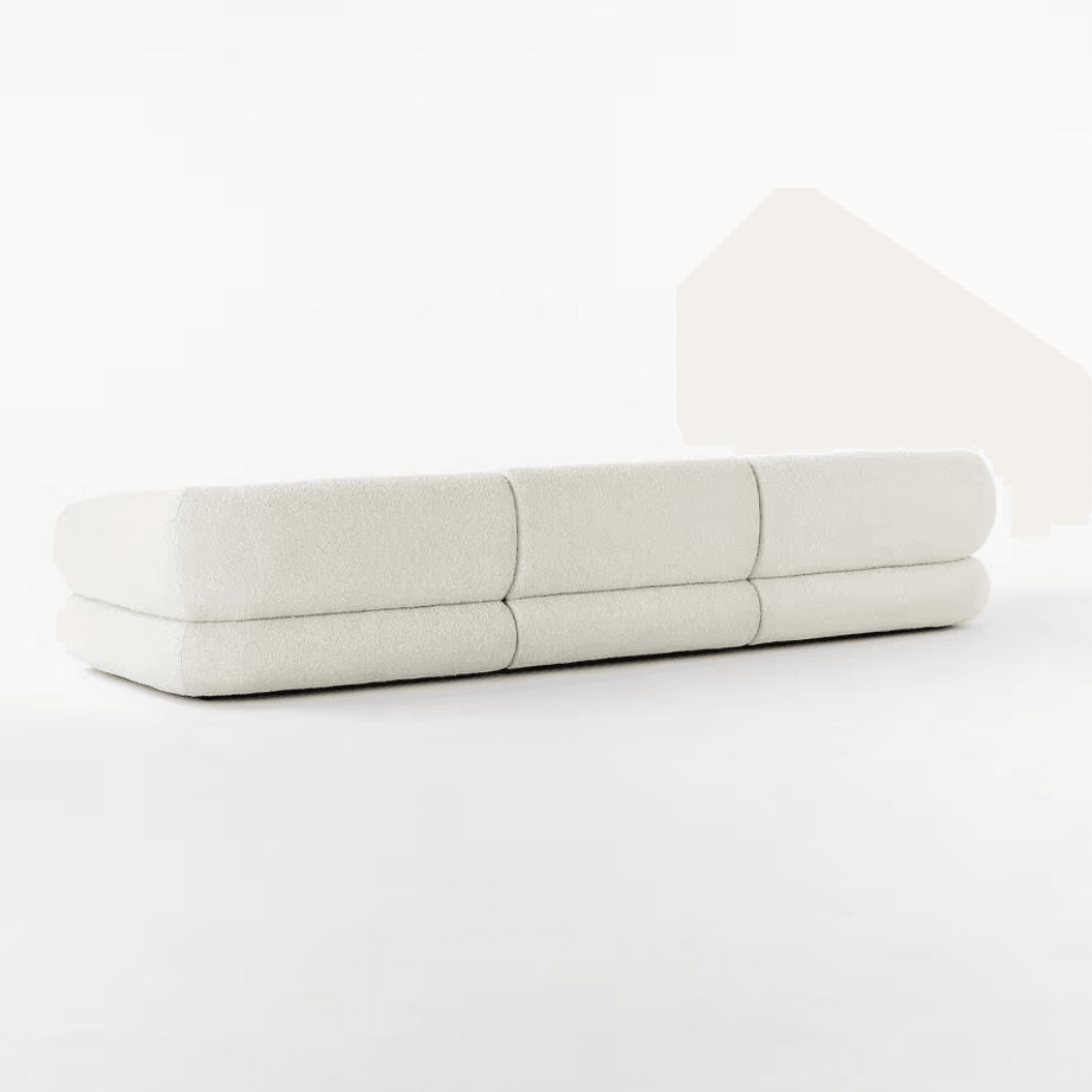 Back view of the Eloise Boucle Sofa in off-white bouclé fabric, showcasing its sculpted base and contemporary design for modern homes in UAE.