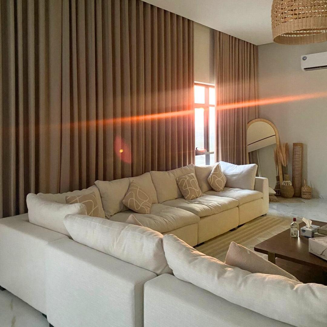 Feather Modular Cloud Sofa in an elegant living room, styled with beige linen fabric and L-shaped design. Perfect for cozy, modern interiors in UAE.