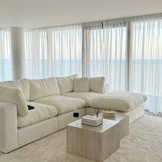 Feather Modular Cloud Sofa in a modern living room, featuring an L-shaped design with off-white linen fabric. Perfect for contemporary homes in UAE.