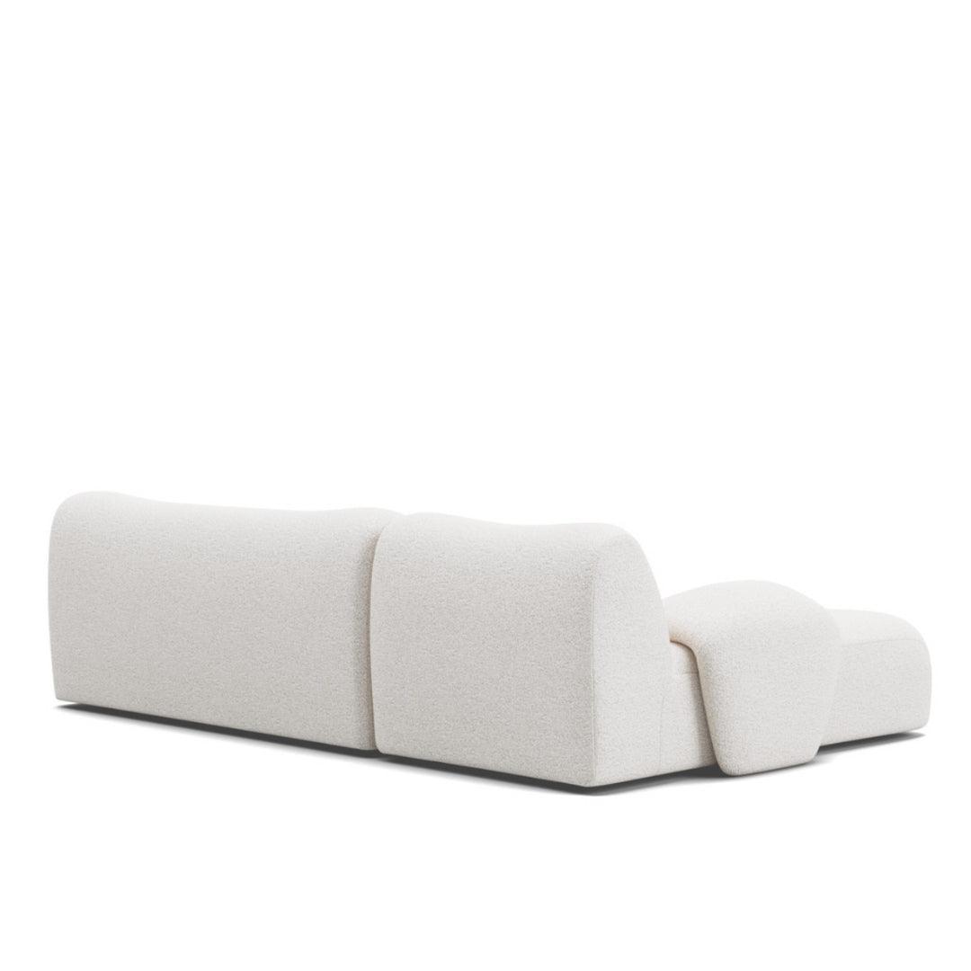 Back view of the Fiam Sofa in off-white boucle fabric, highlighting its sleek and minimalist L-shaped design. Perfect for contemporary homes in UAE.