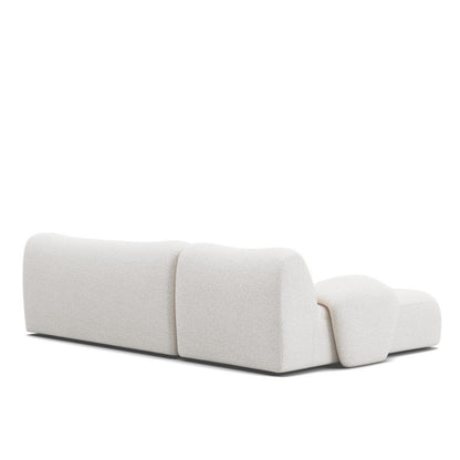 Back view of the Fiam Sofa in off-white boucle fabric, highlighting its sleek and minimalist L-shaped design. Perfect for contemporary homes in UAE.