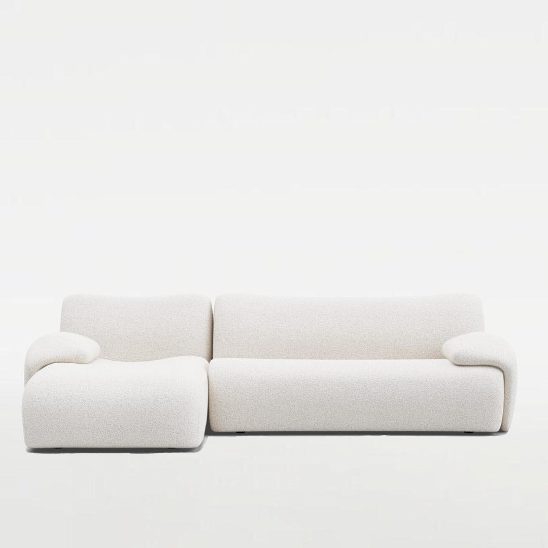 Fiam Sofa in off-white boucle fabric, featuring an elegant L-shaped design. Perfect for modern and stylish living rooms in UAE.