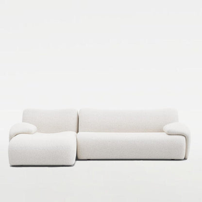 Fiam Sofa in off-white boucle fabric, featuring an elegant L-shaped design. Perfect for modern and stylish living rooms in UAE.