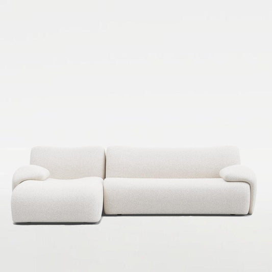 Fiam Sofa in off-white boucle fabric, featuring an elegant L-shaped design. Perfect for modern and stylish living rooms in UAE.