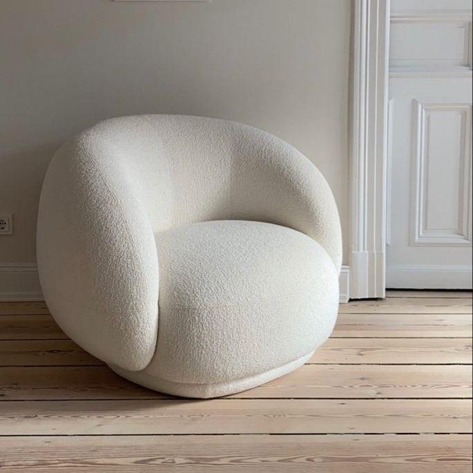 Cloud Boucle Armchair in white boucle fabric with a curved backrest, shown in a modern interior setting, perfect for stylish homes in the UAE.